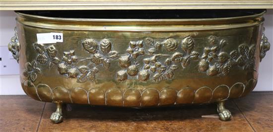 An Edwardian embossed brass planter width 68cm